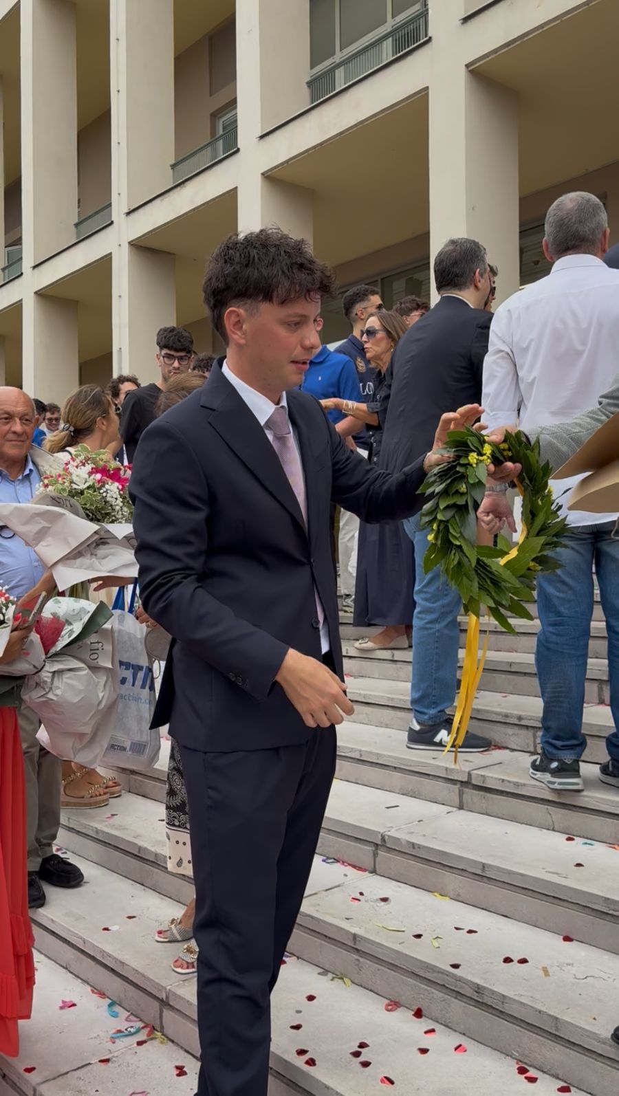 Matteo on graduation day with the laurel wreath