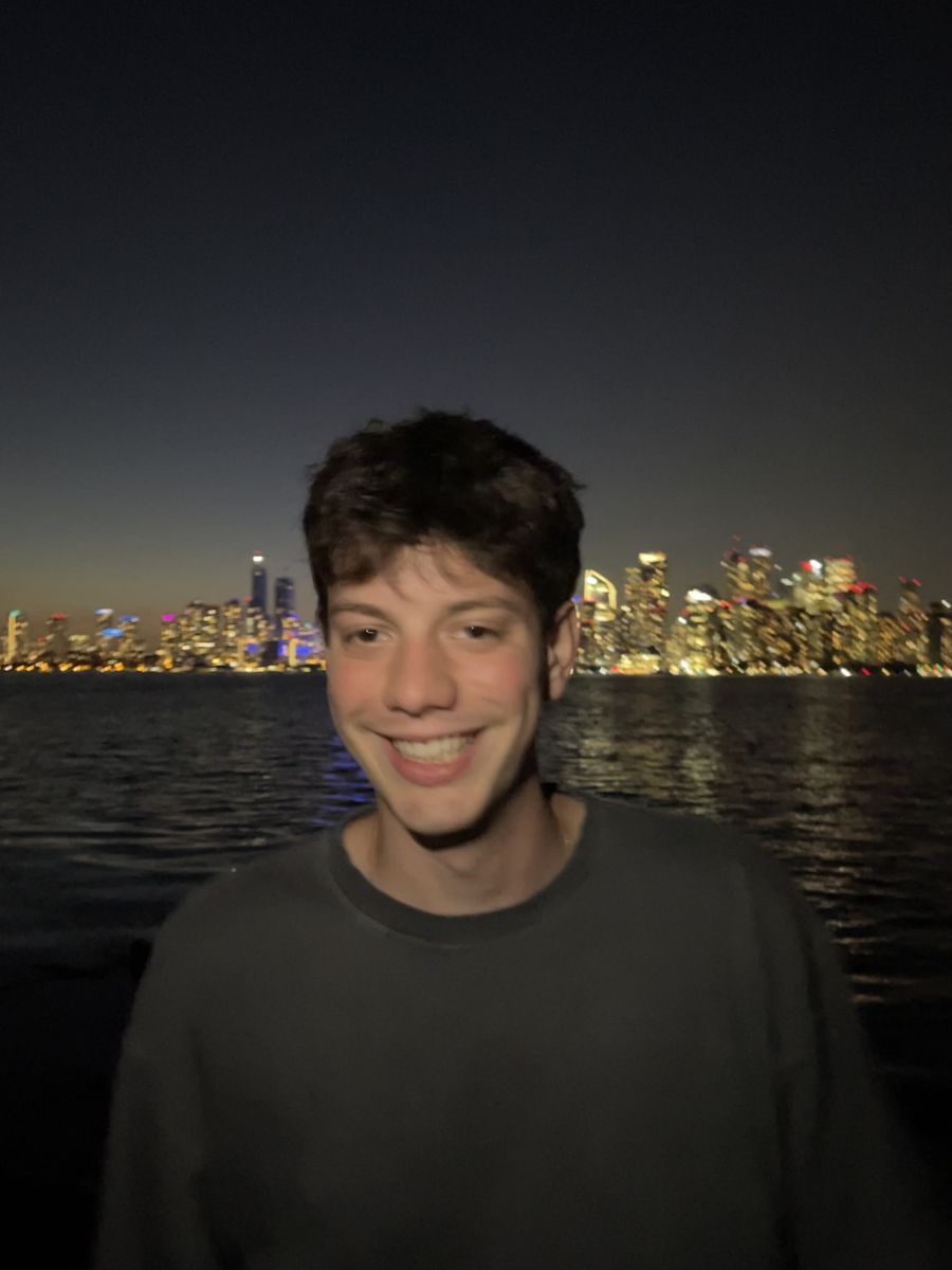 Matteo in front of the Toronto skyline at night
